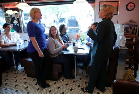 U.S. Democratic presidential candidate Hillary Clinton speaks to customers at the Court Street Diner during a campaign stop in Athens, Ohio, United States, May 3, 2016. REUTERS/Jim Young