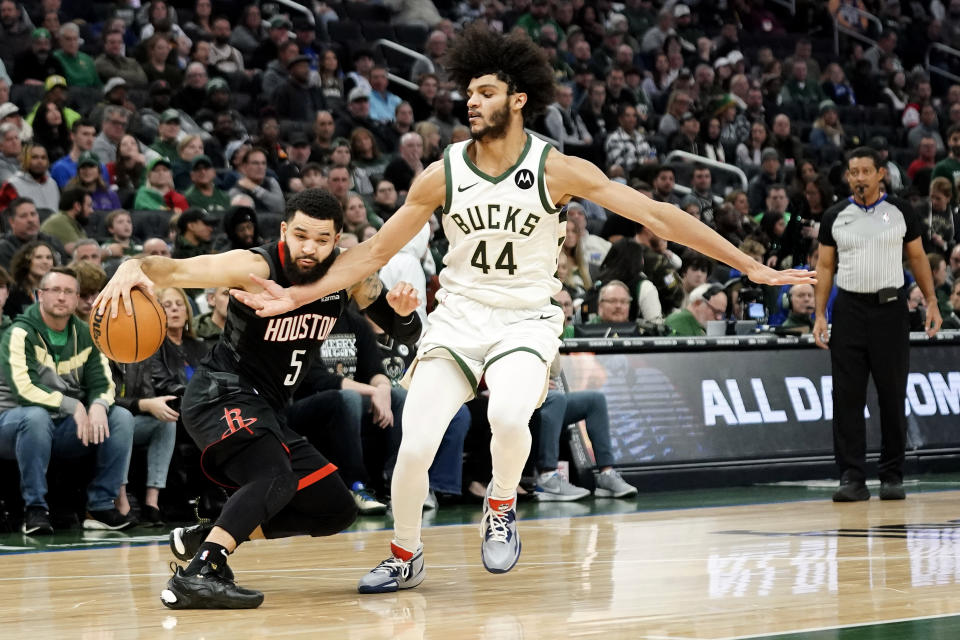 Houston Rockets' Fred VanVleet (5) dribbles against Milwaukee Bucks' Andre Jackson Jr. (44) during the first half of an NBA basketball game Sunday, Dec. 17, 2023, in Milwaukee. (AP Photo/Aaron Gash)