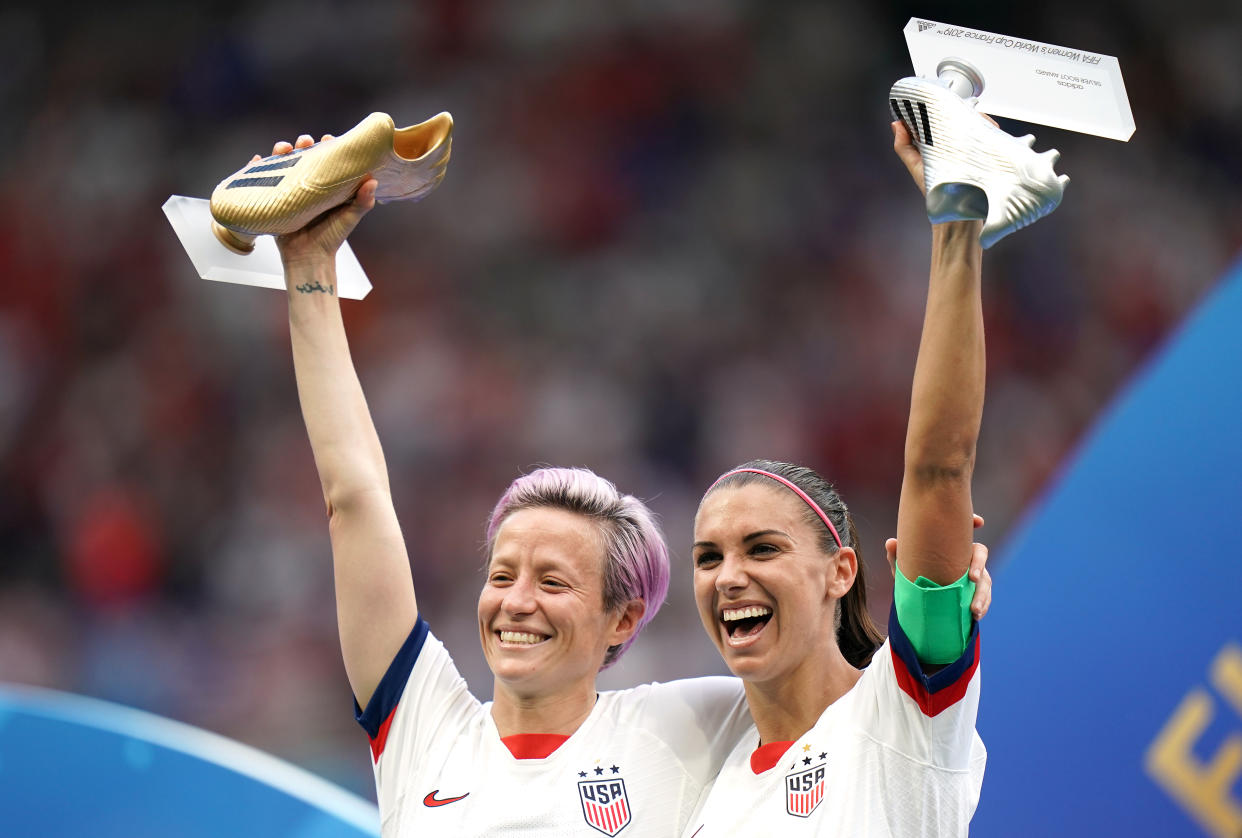 USA's Megan Rapinoe (left) and Alex Morgan with the adidas Golden Boot and adidas Silver Boot respectively after the final whistle USA v Netherlands - FIFA Women's World Cup 2019 - Final - Stade de Lyon 07-07-2019 . (Photo by  John Walton/EMPICS/PA Images via Getty Images)