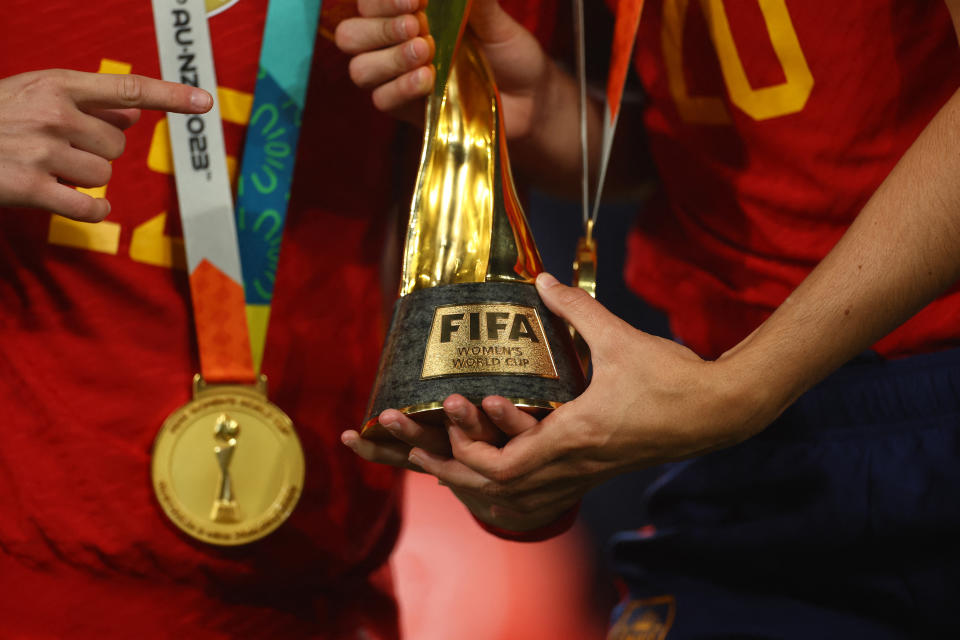 Soccer Football - FIFA Women's World Cup Australia and New Zealand 2023 - Final - Spain v England - Stadium Australia, Sydney, Australia - August 20, 2023 General view of a Spain player holding the World Cup trophy after the match REUTERS/Carl Recine