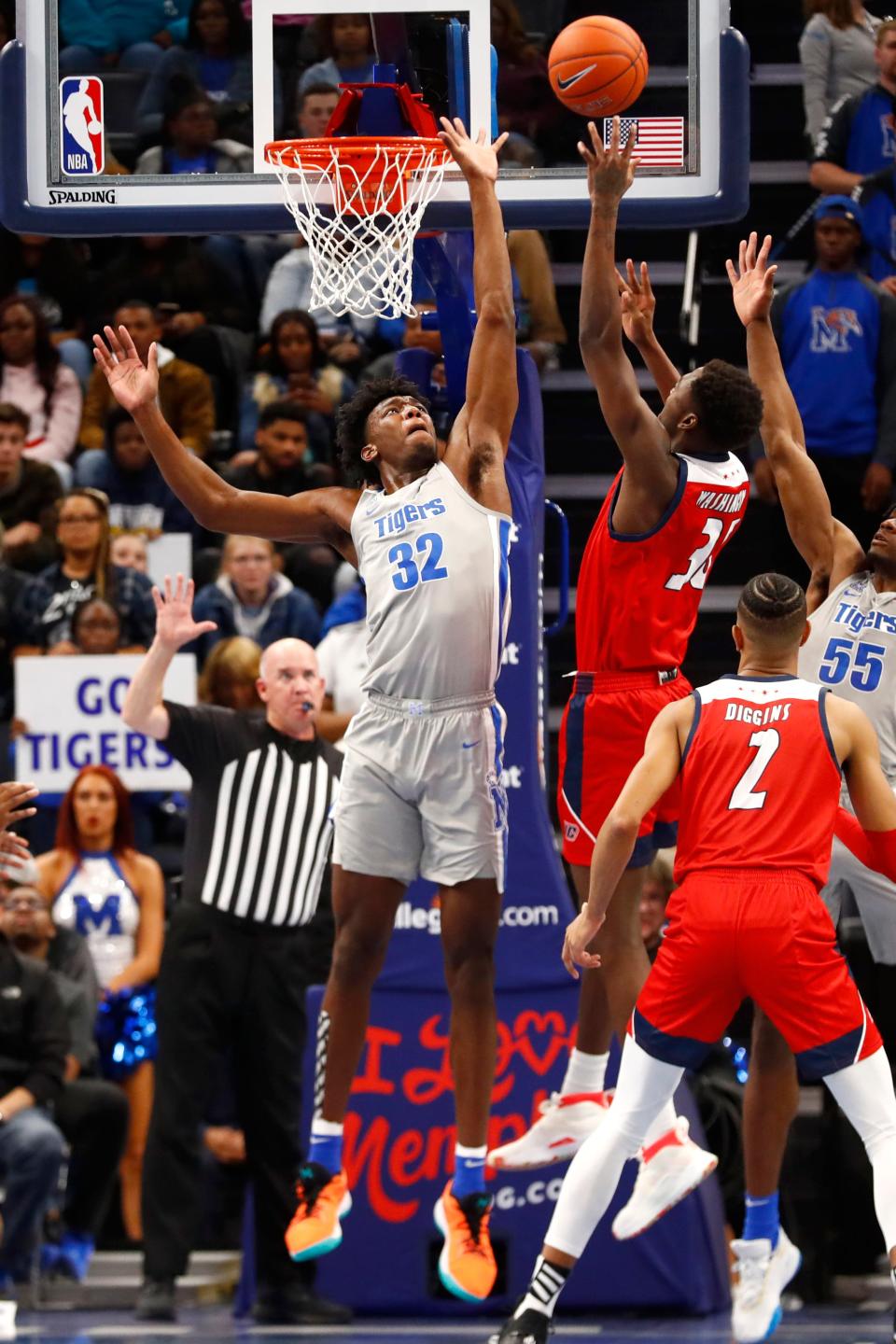 Memphis Tigers center James Wiseman blocks a shot by UIC Flames forward Travell Washington at the FedExForum on Friday, Nov. 8, 2019. Earlier in the day, Wiseman was declared ineligible by the NCAA.