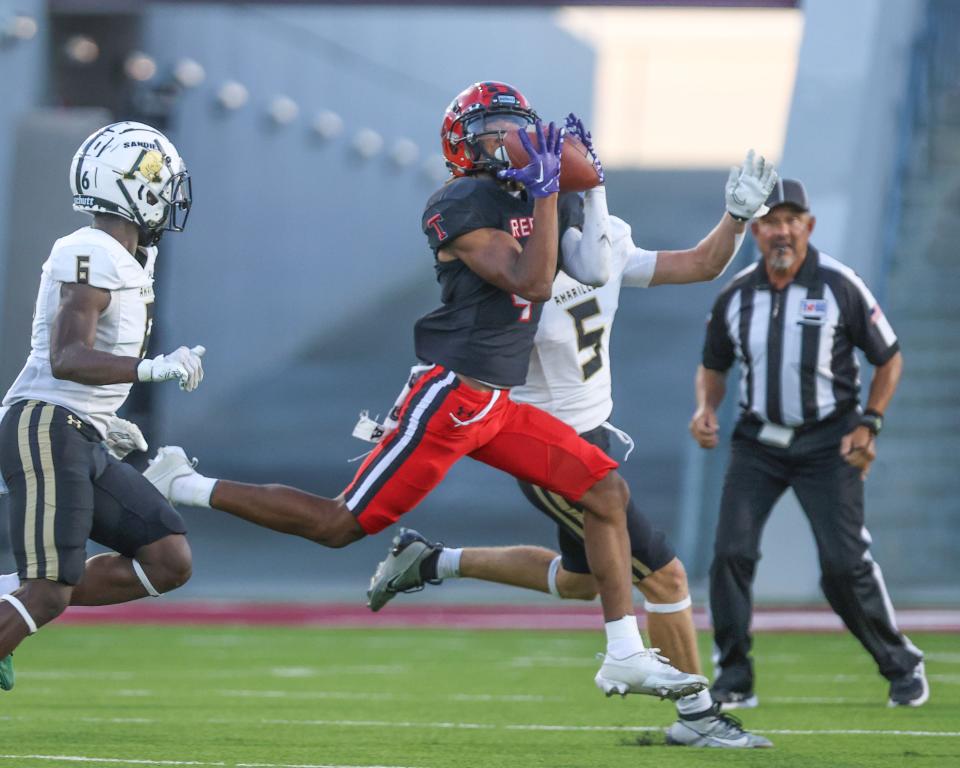 Amarillo Tascosa wide receiver T.J. Tillman catches a pass during a Sept. 22 game against Amarillo High. Tillman, who averaged 21 yards per reception during his sophomore and junior seasons, made a commitment Sunday to Texas Tech.
