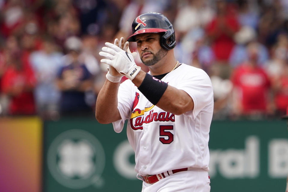 St. Louis Cardinals' Albert Pujols celebrates after hitting a ground-rule double to score Tyler O'Neill during the fifth inning of a baseball game against the Cincinnati Reds Sunday, June 12, 2022, in St. Louis. (AP Photo/Jeff Roberson)