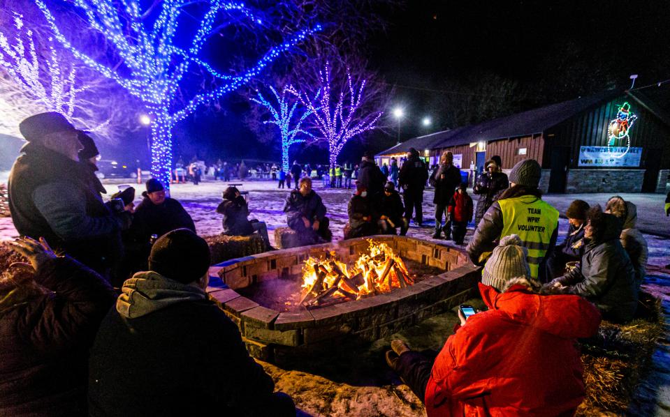 Visitors gather near the fire pit in Lowell Park during the Waukesha Janboree in 2022. The 2023 edition begins Jan. 13.