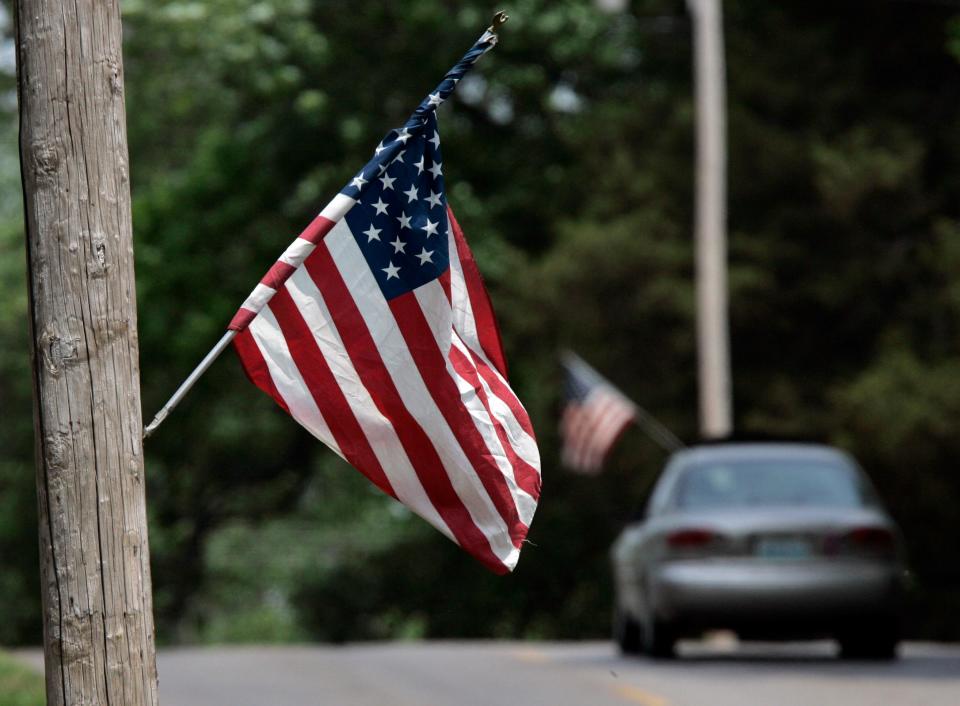 american flag on street pole USA america