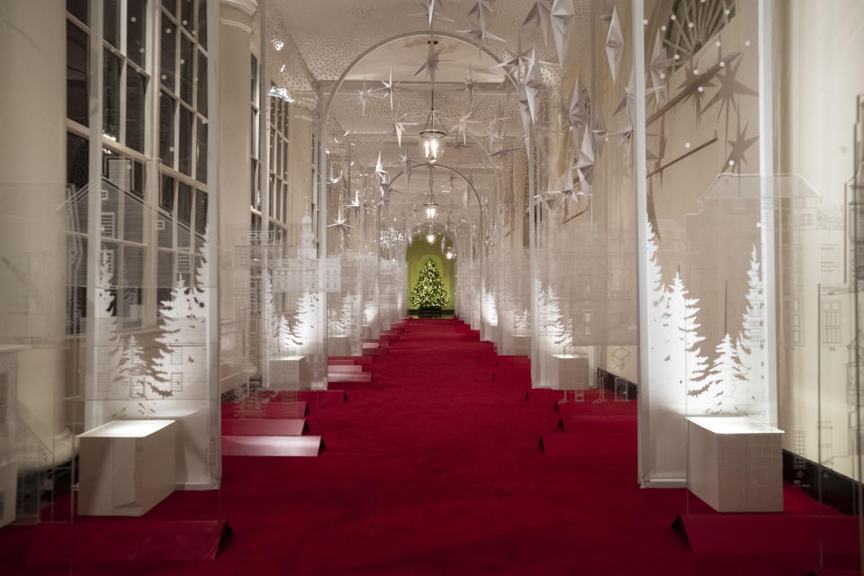 The East Colonnade is decorated with a timeline of American design, innovation and architecture during the 2019 Christmas preview at the White House, Monday, Dec. 2, 2019, in Washington. This year's theme is, "The Spirit of America." (AP Photo/Alex Brandon)