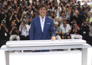 Tom Cruise poses for photographers at the photo call for the film 'Top Gun: Maverick' at the 75th international film festival, Cannes, southern France, Wednesday, May 18, 2022. (Photo by Vianney Le Caer/Invision/AP)