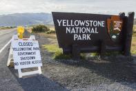 A sign announces the closure of the Yellowstone National Park in Wyoming October 2, 2013 in the wake of the government shutdown. U.S. President Barack Obama scaled back a long-planned trip to Asia on October 2, 2013 and planned a meeting with Democratic and Republican leaders in Congress that both sides said was unlikely to yield an end to the government shutdown. REUTERS/Christopher Cauble (UNITED STATES - Tags: POLITICS TRAVEL)