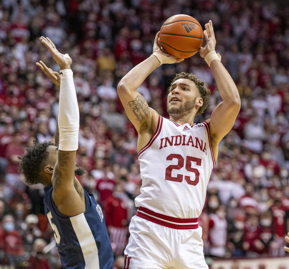 Indiana forward Race Thompson (25) takes a shot over the defense of Penn State forward Greg Lee (5) during the second half of an NCAA college basketball game, Wednesday, Jan. 26, 2022, in Bloomington, Ind. (AP Photo/Doug McSchooler)