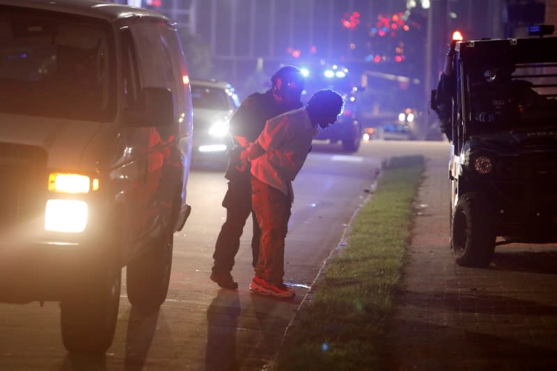 A riot policeman arrests a protester during nationwide unrest following the death in Minneapolis police custody of George Floyd, in Raleigh