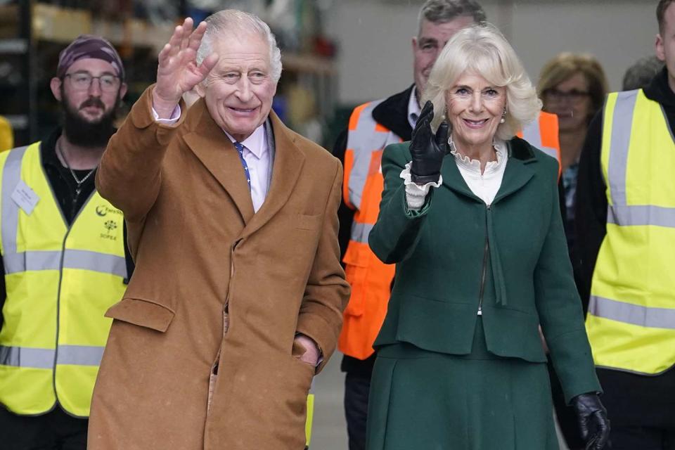 <p>Andrew Matthews/PA Images via Getty Images</p> King Charles and Queen Camilla at the food surplus distribution centre on Nov. 14