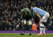 Manchester City's goalkeeper Ederson, left, and Manchester City's John Stones react after Manchester City's Fernandinho scores an own goal during the English Premier League soccer match between Manchester City and Crystal Palace at Etihad stadium in Manchester, England, Saturday, Jan. 18, 2020. (AP Photo/Rui Vieira)