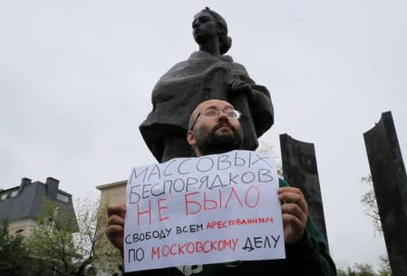 Russian journalist Ilya Azar takes part in a protest demanding authorities to allow opposition candidates to run in the upcoming local election and release people arrested for participation in opposition rallies, in Moscow