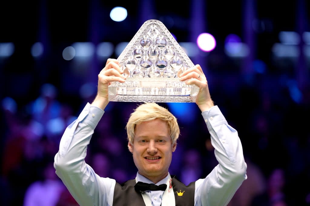 Neil Robertson celebrates with the Paul Hunter trophy after his 10-4 Masters victory over Barry Hawkins (John Walton/PA) (PA Wire)