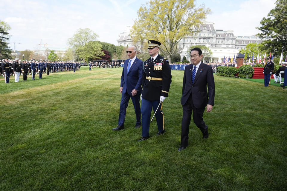 President Joe Biden and Japanese Prime Minister Fumio Kishida walk to review the troops during a State Arrival Ceremony on the South Lawn of the White House, Wednesday, April 10, 2024, in Washington. (AP Photo/Alex Brandon)