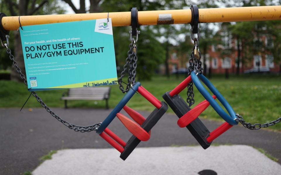 Activity equipment in the children's playground area of a park in London is closed off, as the UK continues in lockdown to help curb the spread of the coronavirus - Yui Mok /PA 
