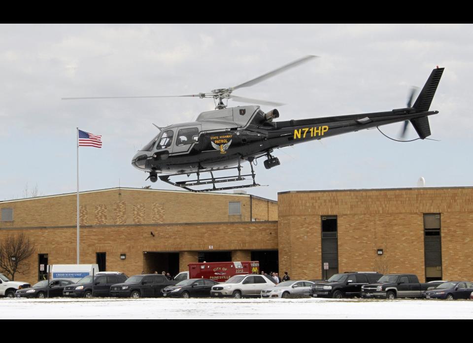 An Ohio Highway Patrol helicopter takes off from the rear of Chardon High School in Chardon, Ohio on Feb. 27, 2012. A gunman opened fire inside the high school's cafeteria at the start of the school day Monday, killing three students and wounding two others, officials said.