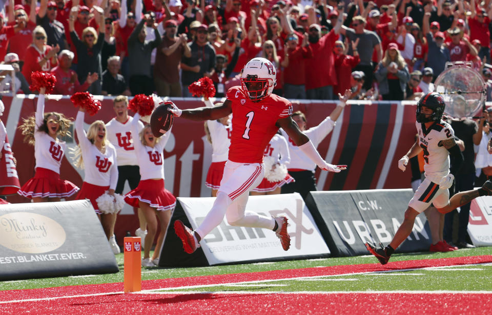 FILE - Utah's Clark Phillips III (1) glides into the end zone for a touchdown after intercepting a pass during an NCAA college football game against Oregon State, Saturday, Oct. 1, 2022, in Salt Lake City. Phillips was named All-Pac12 defensive player of the year Thursday, Dec. 8, 2022. (Scott G Winterton/The Deseret News via AP, File)