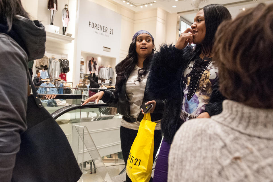 People shop at Forever 21 in New York City the day before Christmas. (Photo by Stephanie Keith/Getty Images)