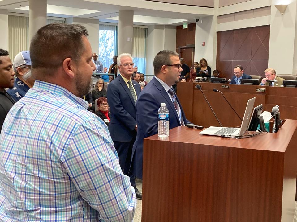 Corrections Director Joseph DeMore speaks to the County Council on Tuesday. At left is Matt Harrison, president of the Volusia County Corrections Officers Union. At center is Mark Swanson, county Public Protection director.