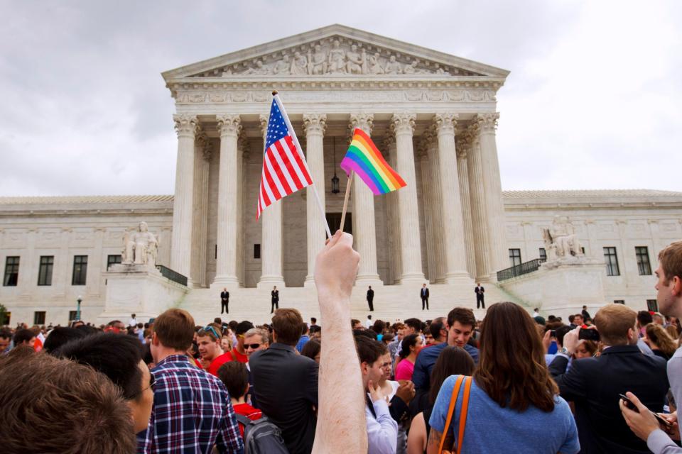 Gay rights advocates celebrated outside the Supreme Court in 2015 after the justices legalized same-sex marriage nationwide. On Tuesday, they will address LGBTQ employment discrimination.