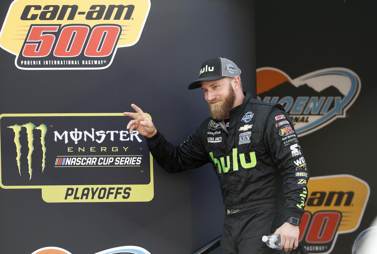 Jeffrey Earnhardt waves to the crowd during driver introductions prior to a NASCAR Cup Series auto race at Phoenix International Raceway Sunday, Nov. 12, 2017, in Avondale, Ariz. (AP Photo/Ross D. Franklin)