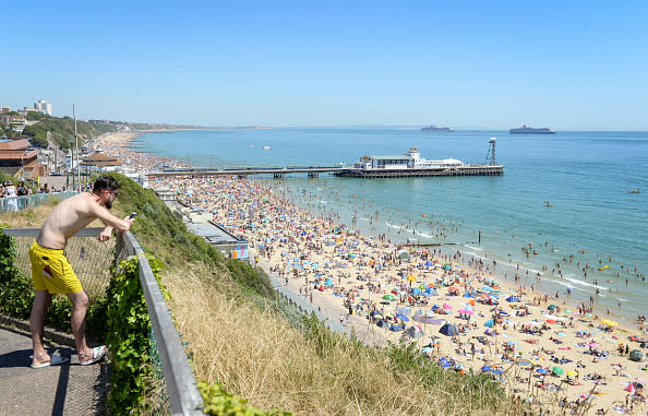 Visitors enjoy the hot weather on the beach in Bournemouth, United Kingdom.