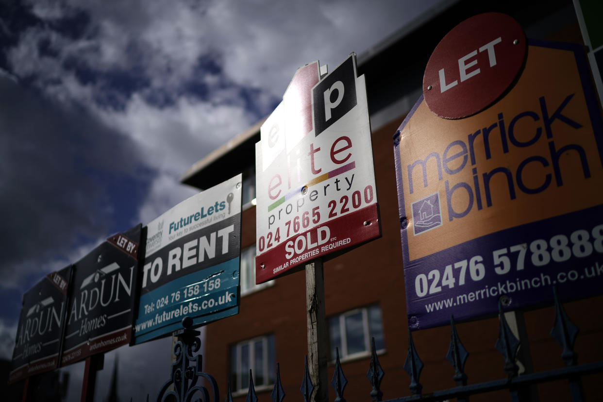 Estate agent “For Sale” and “To Let” signs adorn a fence next to houses on March 14, 2019 in Coventry, England. Photo: Christopher Furlong/Getty Images