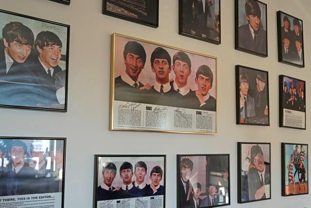 Copies of Ray's Beatles autographs are framed and displayed at his home