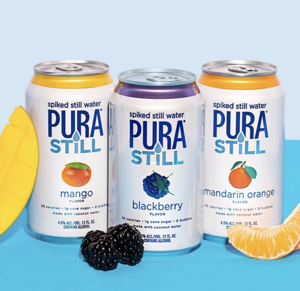 Pura Still spiked water cans