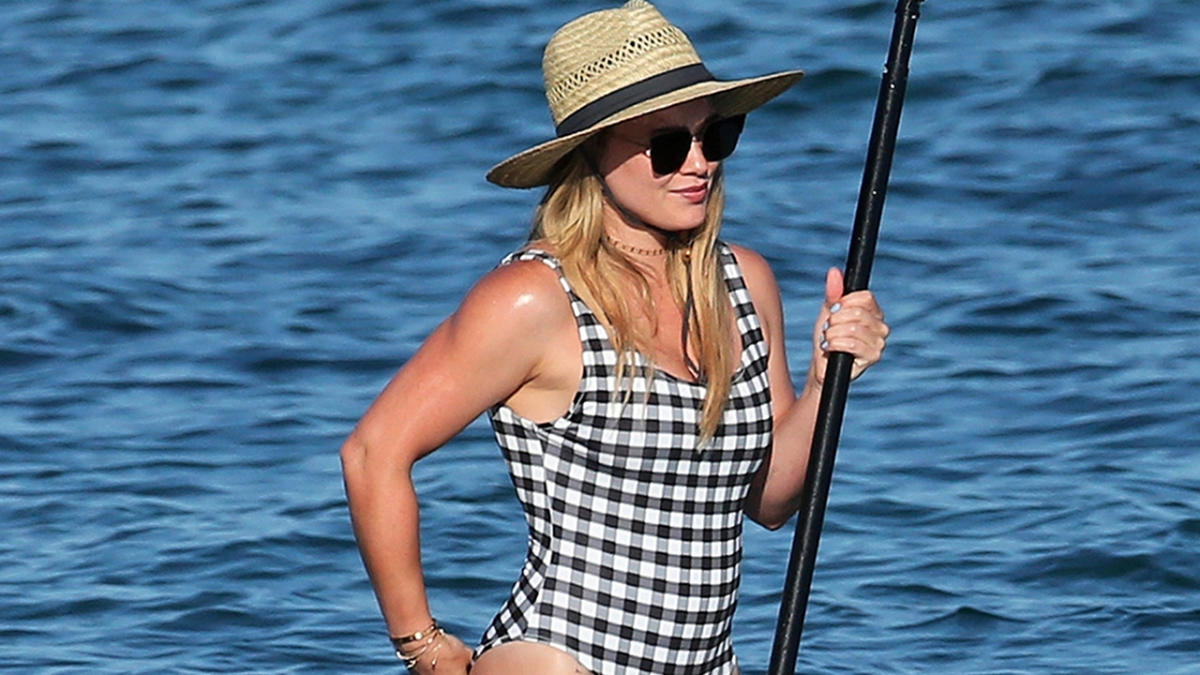 Hilary Duff flaunts her incredible figure in VERY tight swimsuit