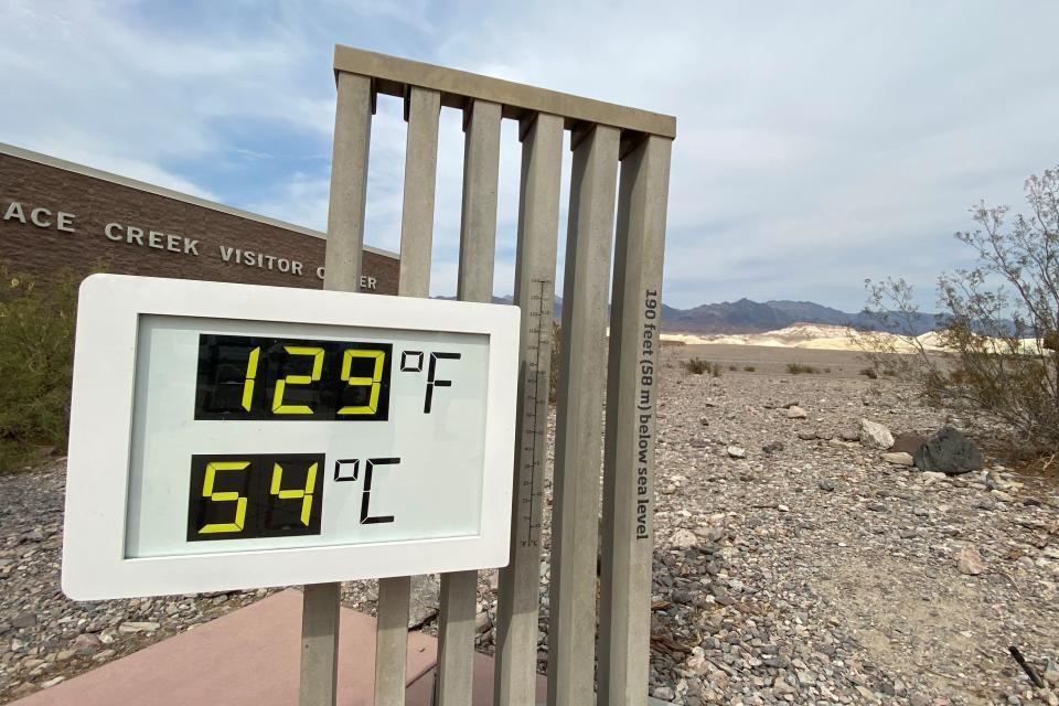 The thermometer at the Furnace Creek Visitor Center at Death Valley National Park shows temperatures reading 129 degrees Fahrenheit (53.8 C) in Death Valley, California, U.S. June 16, 2021. Picture taken June 16, 2021.  REUTERS/Norma Galeana