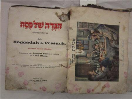 A Passover Haggadah from Vienna, 1930 is pictured before treatment in this undated handout photo from the National Archives obtained by Reuters November 26, 2013. REUTERS/The U.S. National Archives and Records Administration/Handout via Reuters