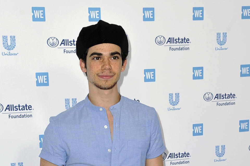 FILE - In this April 25, 2019, file photo, Cameron Boyce arrives at WE Day California at The Forum in Inglewood, Calif. Actor Cameron Boyce, known for his roles in the Disney Channel franchise “Descendants” and the Adam Sandler “Grown Ups” movies, died Saturday, July 6, 2019, at his home in Los Angeles, according to his spokesperson. He was 20. (Photo by Richard Shotwell/Invision/AP, File)