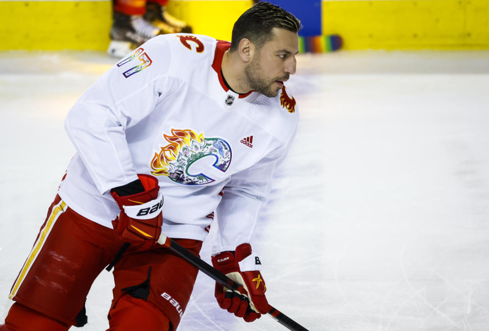 Calgary Flames forward Milan Lucic wears a Pride jersey while warming up for the team's NHL hockey game against the Los Angeles Kings on Tuesday, March 28, 2023, in Calgary, Alberta. (Jeff McIntosh/The Canadian Press via AP)w