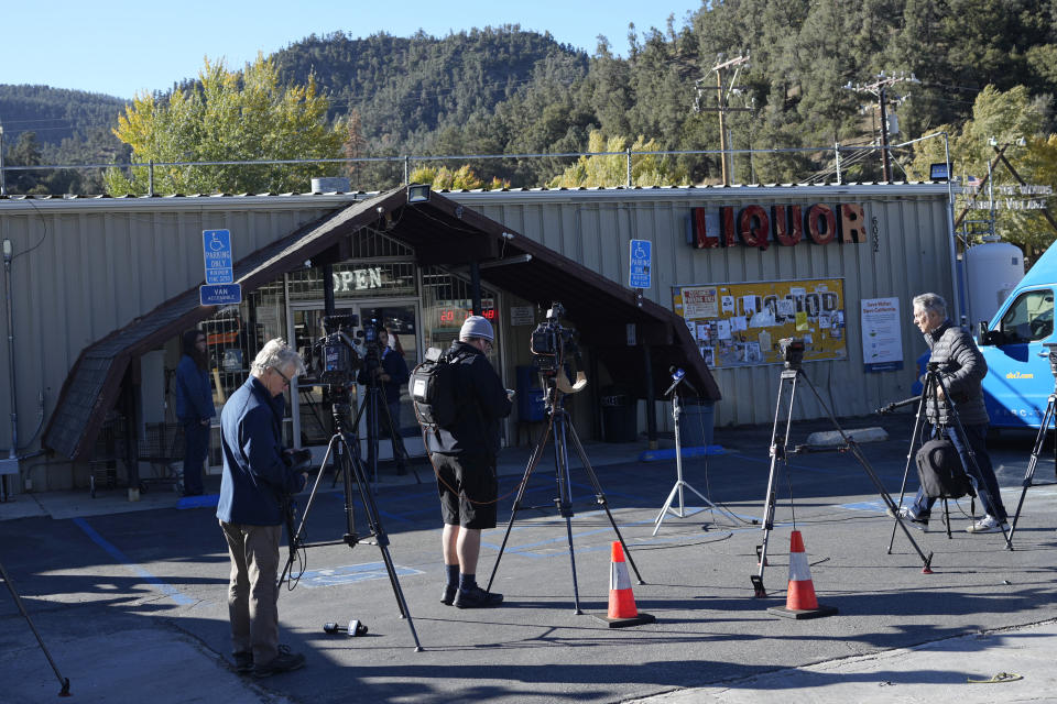 Media gather outside the Midway Market & Liquor store where a winning lottery ticket was sold in Frazier Park, Calif., Thursday, Oct. 12, 2023. A player in California won a $1.765 billion Powerball jackpot Wednesday night, ending a long stretch without a winner of the top prize. (AP Photo/Marcio Jose Sanchez)