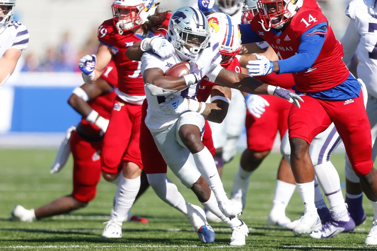 Kansas State sophomore running back Joe Ervin (20) makes it through the Kansas defense during the Nov. 6 Sunflower Showdown in Lawrence.