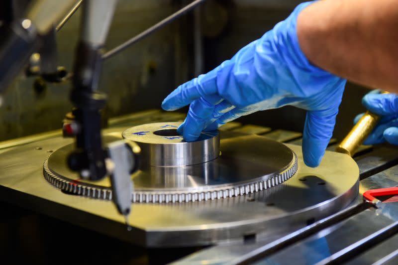 FILE PHOTO: A worker at the Liebherr manufacturing company in Collegno, Italy