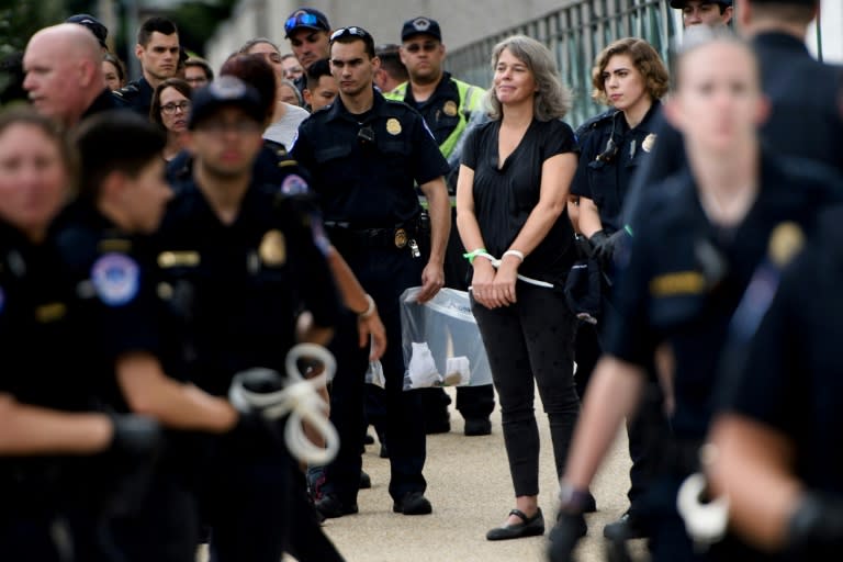 Activists are arrested during protests against Judge Brett Kavanaugh on Capitol Hill