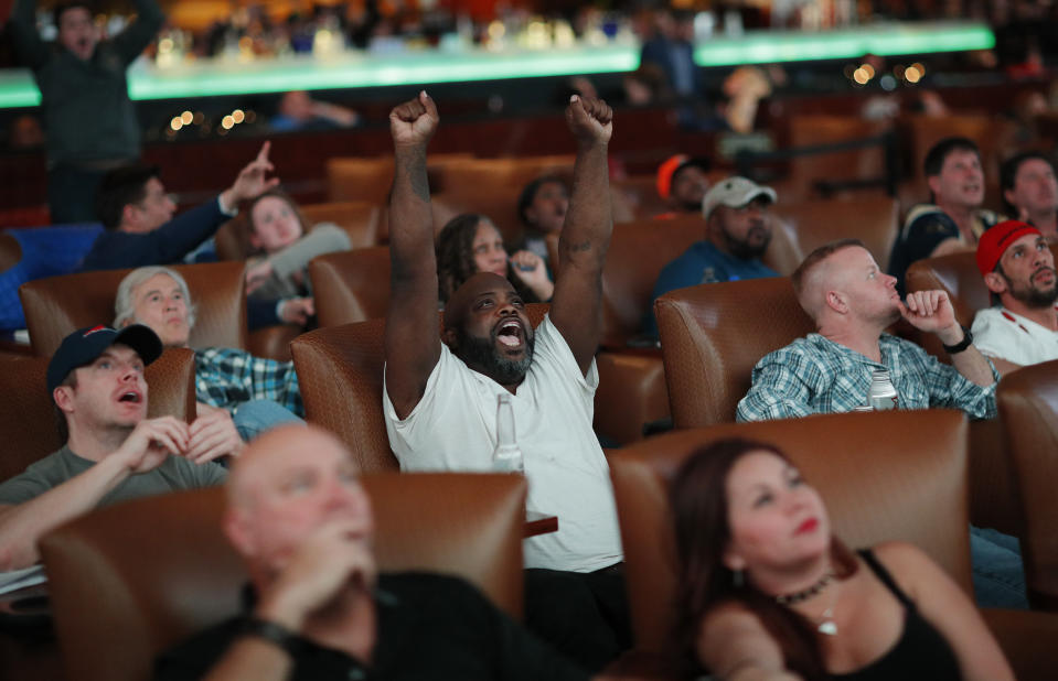 Christopher McCray, of Henderson, Nev., reacts while watching Super Bowl LIII at the Westgate Superbook sports book, Sunday, Feb. 3, 2019, in Las Vegas. (AP Photo/John Locher)