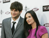 Cast member Demi Moore (R) and her husband, actor Ashton Kutcher, arrive at the premiere of "The Joneses" in Los Angeles.