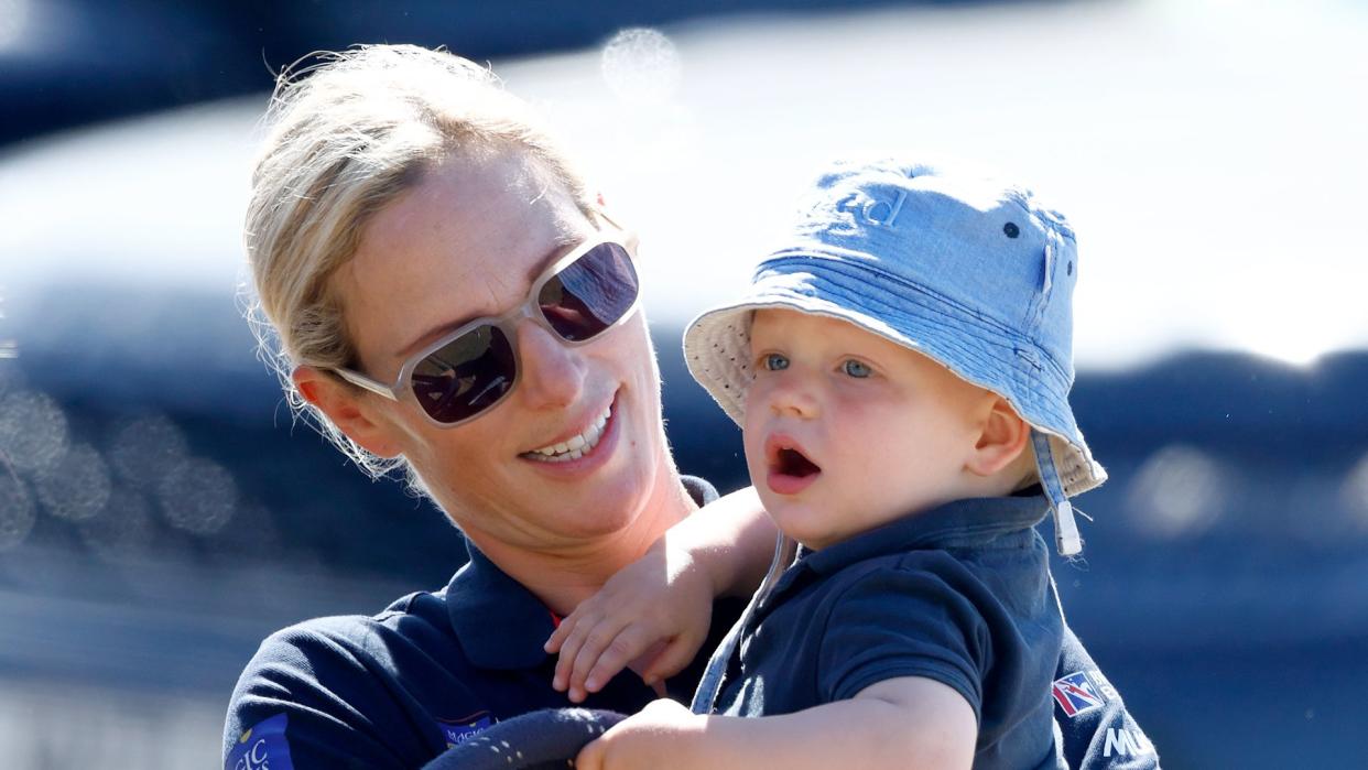 Zara Tindall holding a baby Lucas Tindall