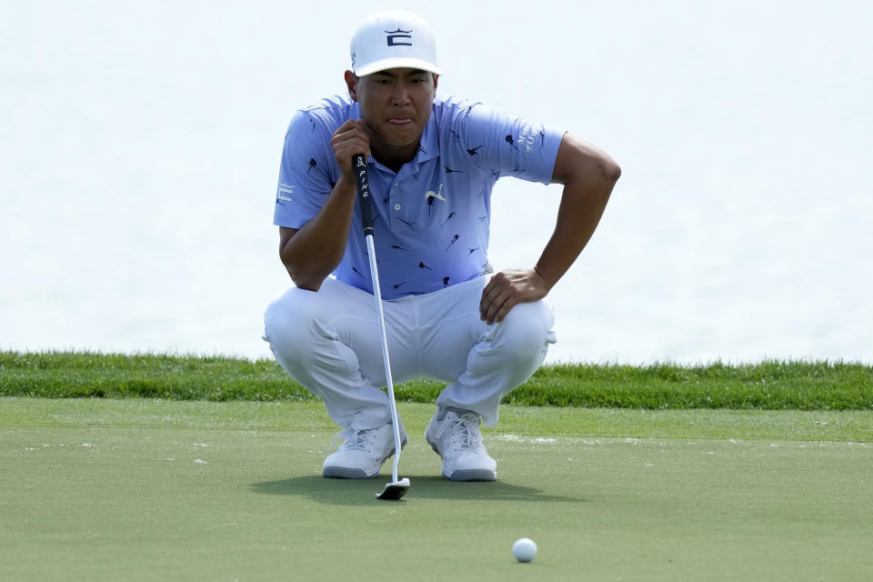 Justin Suh lines up a putt on the 18th green during the second round of the Honda Classic golf tournament, Friday, Feb. 24, 2023, in Palm Beach Gardens, Fla. (AP Photo/Lynne Sladky)