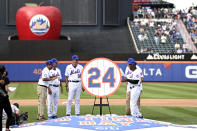 The son of former New York Mets player Willie Mays, Michael Mays, left, talks with former Mets' player Felix Milan (17), Jon Matlack (32), Ed Kranepool, second from right, and Cleon Jones, right, after the team retired No. 24 in honor of Willie Mays during an Old-Timers' Day ceremony before a baseball game between the Colorado Rockies and the Mets, Saturday, Aug. 27, 2022, in New York. (AP Photo/Adam Hunger)