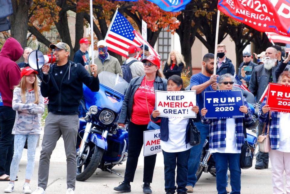 In this Nov. 7, 2020, file photo, hundreds of supporters of President Donald Trump stage a defiant rally outside the New Mexico state Capitol building in Santa Fe, N.M. Voters participated in record numbers while choosing Joe Biden by an 11% margin over Donald Trump, even as the GOP won back a congressional swing seat in southern New Mexico. Most voters opted for absentee ballots due to the pandemic, while Republicans cried foul over ballot drop boxes in lawsuits.