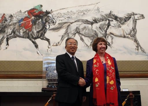 EU foreign policy chief Catherine Ashton (R) and Chinese State Councillor Dai Bingguo shake hands before talks for the third EU-China Strategic Dialogue meeting in Beijing. China said it believed Europe could resolve its debt crisis, as the two sides held a high-level meeting in Beijing that also covered thorny issues such as Syria, Iran and human rights