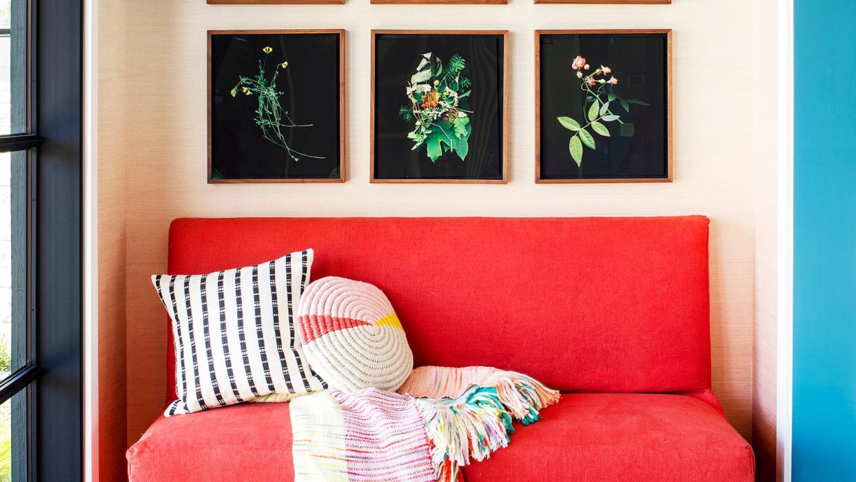 red color theory, a red sofa in a room