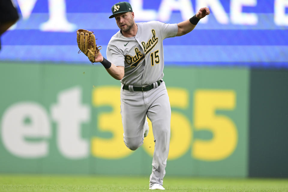 Oakland Athletics left fielder Seth Brown catches a ball hit by Cleveland Guardians' Bo Naylor during the fifth inning of a baseball game Tuesday, June 20, 2023, in Cleveland. (AP Photo/David Dermer)