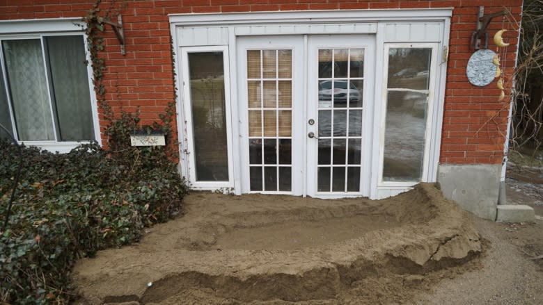 This couple stayed up all night to keep flood water out of their home
