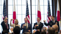 From left; Japan's Prime Minister Shinzo Abe, granddaughter Mary Jean Eisenhower and the great grandson Merrill Eisenhower Atwater of former U.S. President Dwight Eisenhower, acting U.S. Ambassador to Japan Joseph M. Young and Commander of the U.S. Forces in Japan Lieutenant General Kevin Schneider make a toast to celebrate the 60th anniversary commemorative reception of the signing of the Japan-US security treaty at the Iikura Guesthouse in Tokyo, Sunday, Jan. 19, 2020. (Behrouz Mehri)